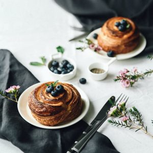 French Pastry with Blueberries Served on Black and White Table Decoration